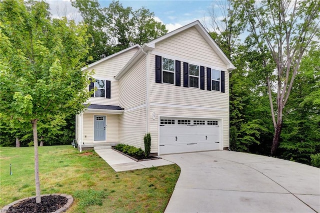 307 Lorraine Dr, Williamsburg, VA 23185 - traditional home featuring a garage, driveway, and a front lawn