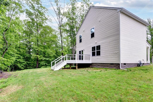 307 Lorraine Dr, Williamsburg, VA 23185 - rear view of property featuring a wooden deck, a yard, crawl space, and stairs