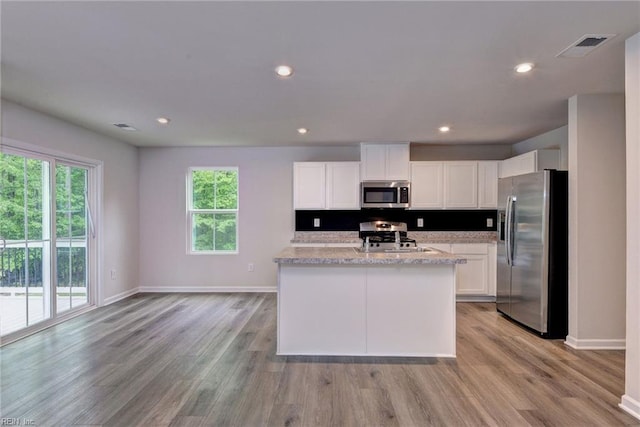 307 Lorraine Dr, Williamsburg, VA 23185 - kitchen featuring appliances with stainless steel finishes, baseboards, white cabinets, light wood-style floors, and recessed lighting