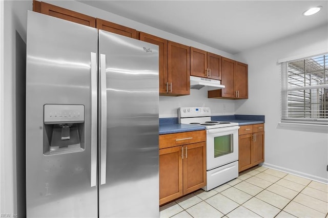 264 Ferdinand Cir, Virginia Beach, VA 23462 - kitchen with stainless steel refrigerator with ice dispenser, electric range, under cabinet range hood, brown cabinetry, and light tile patterned flooring