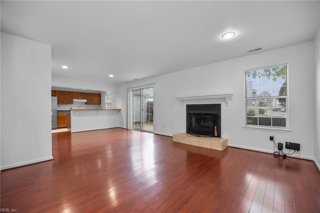 264 Ferdinand Cir, Virginia Beach, VA 23462 - unfurnished living room featuring a tiled fireplace, dark wood-type flooring, recessed lighting, and baseboards