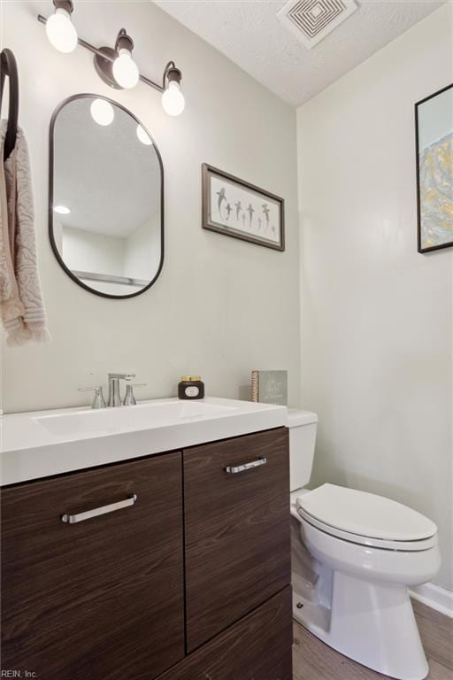 13 Dandy Point Rd, Hampton, VA 23664 - half bathroom with toilet, vanity, and wood finished floors