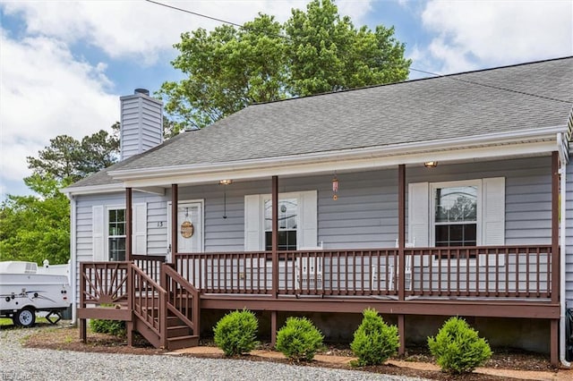 13 Dandy Point Rd, Hampton, VA 23664 - view of front of house with a porch, roof with shingles, and a chimney