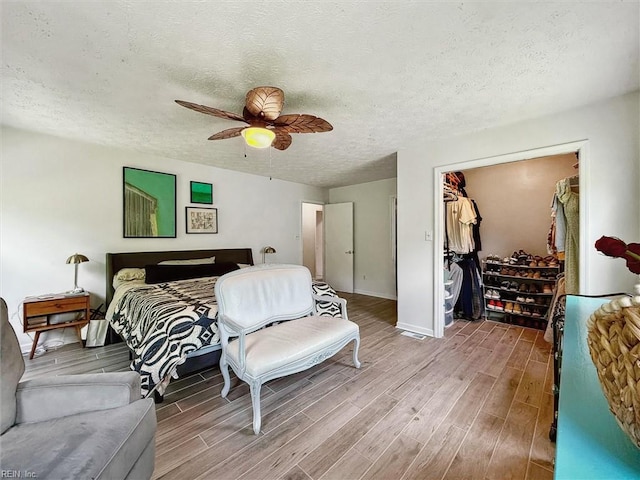 13 Dandy Point Rd, Hampton, VA 23664 - bedroom featuring wood finished floors, a textured ceiling, baseboards, a ceiling fan, and a closet