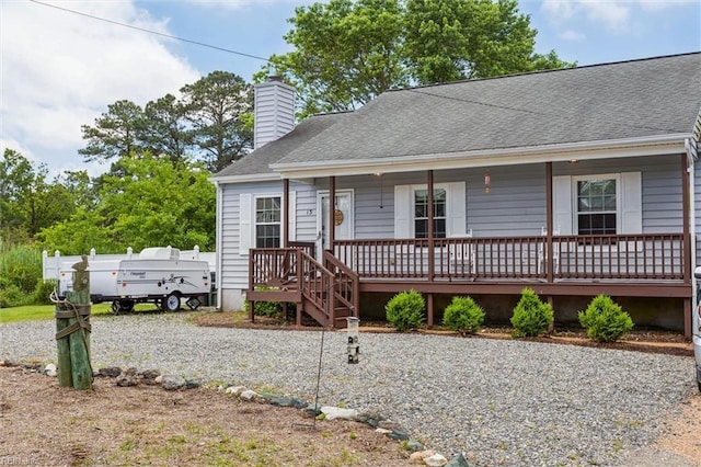 13 Dandy Point Rd, Hampton, VA 23664 - view of front facade featuring covered porch, a chimney, and a shingled roof