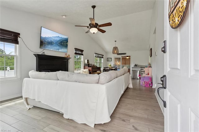13 Dandy Point Rd, Hampton, VA 23664 - living room with healthy amount of natural light, ceiling fan, vaulted ceiling, light wood-style flooring, and baseboards