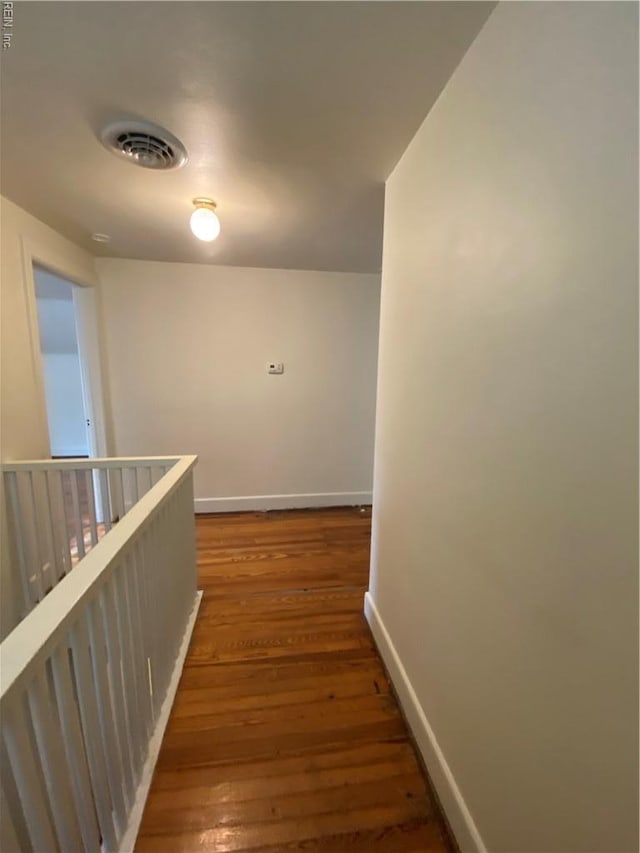 3814 Lenoir Cir, Norfolk, VA 23513 - hall featuring baseboards, wood finished floors, and an upstairs landing