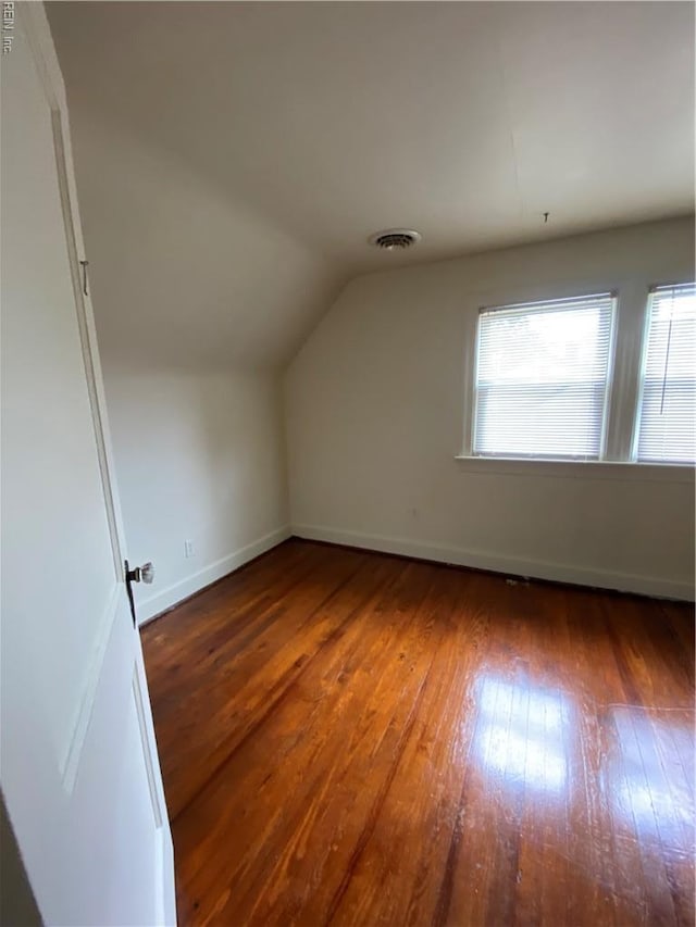 3814 Lenoir Cir, Norfolk, VA 23513 - additional living space with wood-type flooring, vaulted ceiling, and baseboards