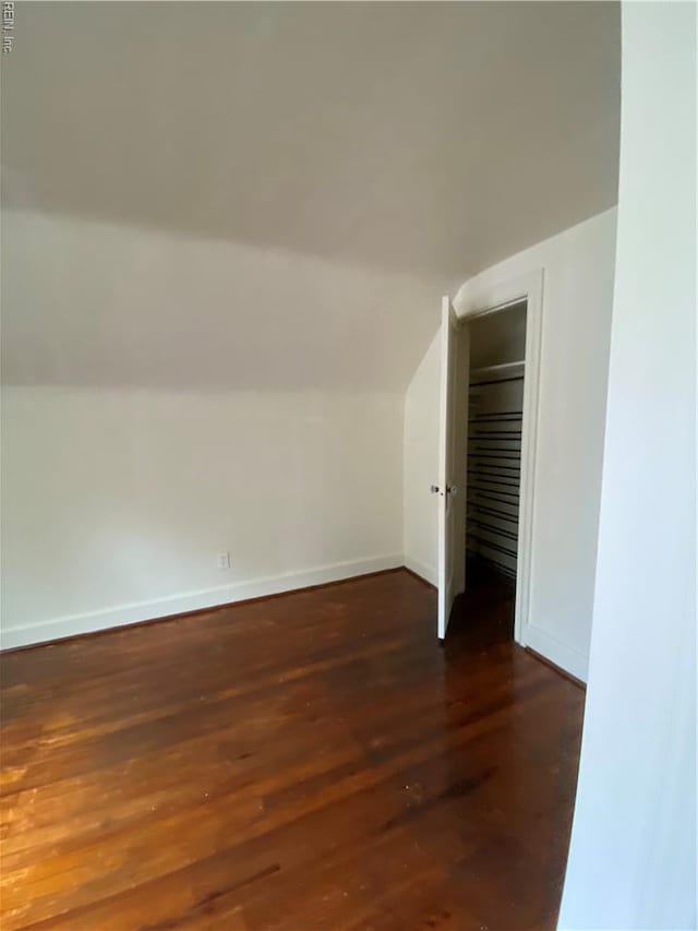 3814 Lenoir Cir, Norfolk, VA 23513 - additional living space with lofted ceiling, dark wood-style flooring, and baseboards