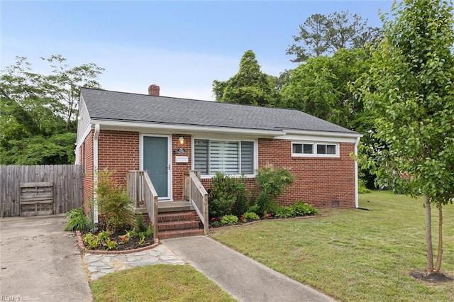 164 Findley Sq, Hampton, VA 23666 - view of front of house featuring brick siding, a chimney, and a shingled roof