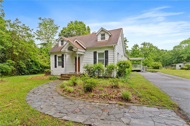 253 S George Washington Hwy, Chesapeake, VA 23323 - cape cod-style house featuring a front yard and driveway