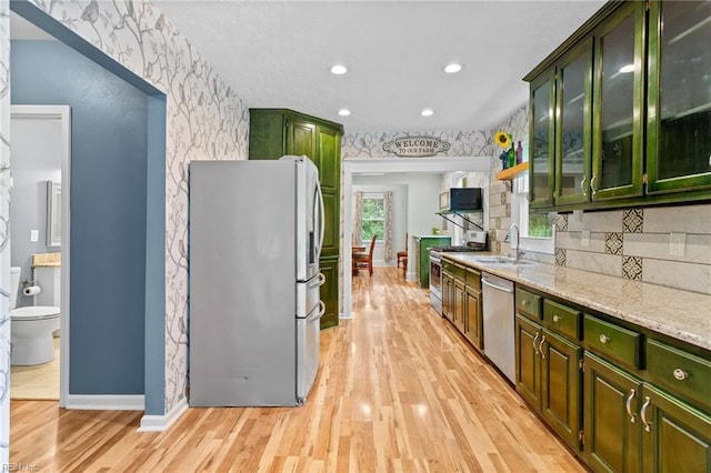 253 S George Washington Hwy, Chesapeake, VA 23323 - kitchen with appliances with stainless steel finishes, green cabinetry, a sink, recessed lighting, and wallpapered walls