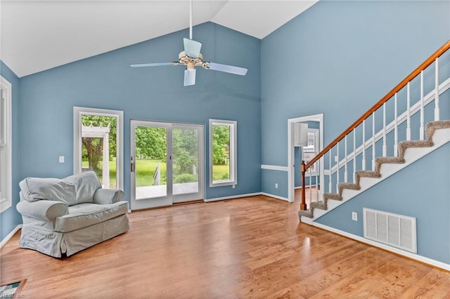 253 S George Washington Hwy, Chesapeake, VA 23323 - living room with wood finished floors, stairway, a ceiling fan, high vaulted ceiling, and baseboards