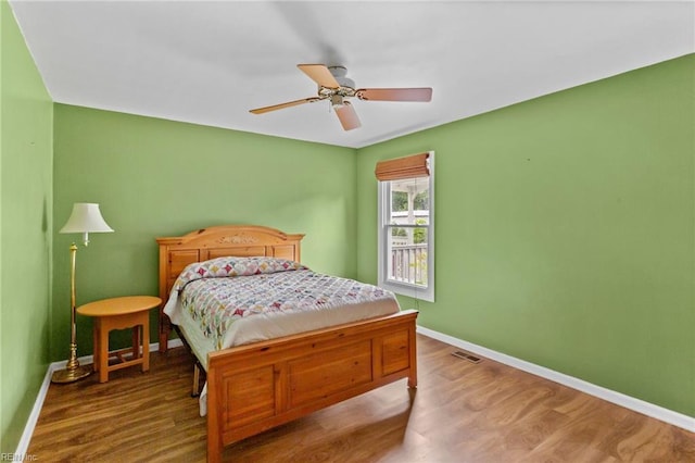 253 S George Washington Hwy, Chesapeake, VA 23323 - bedroom featuring baseboards, wood finished floors, and a ceiling fan