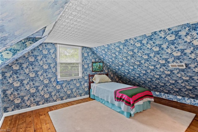 253 S George Washington Hwy, Chesapeake, VA 23323 - bedroom with hardwood / wood-style flooring, baseboards, lofted ceiling, and wallpapered walls