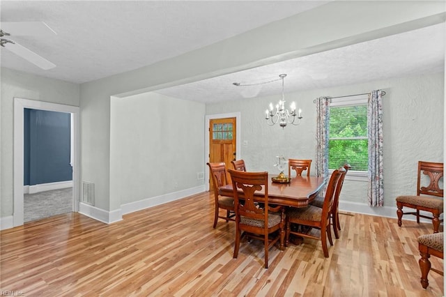 253 S George Washington Hwy, Chesapeake, VA 23323 - dining space with light wood-style flooring, a chandelier, a textured wall, a textured ceiling, and a ceiling fan