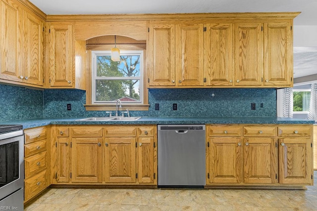 27195 Dogwood Bend Rd, Franklin, VA 23851 - kitchen with appliances with stainless steel finishes, a sink, dark countertops, and brown cabinets