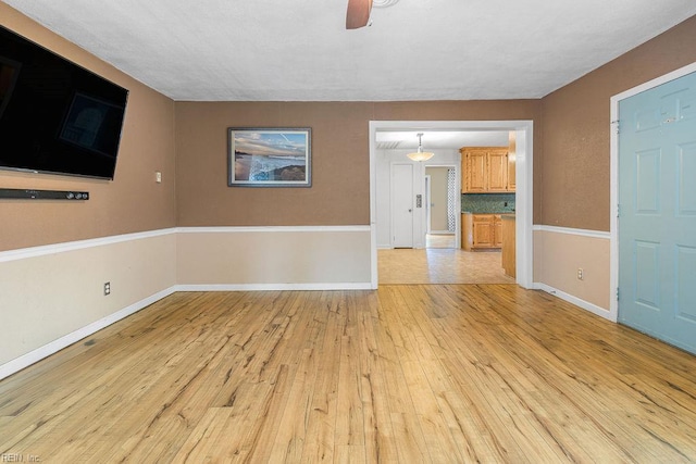 27195 Dogwood Bend Rd, Franklin, VA 23851 - empty room featuring light wood finished floors, ceiling fan, and baseboards