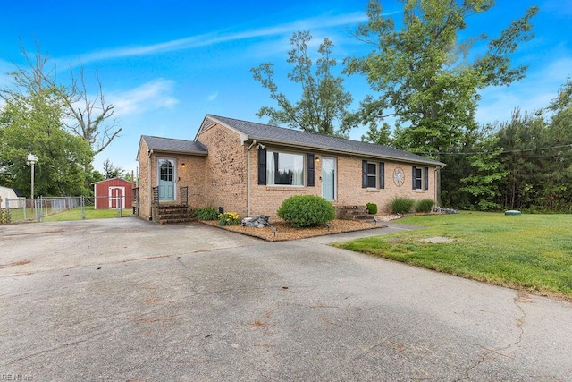 27195 Dogwood Bend Rd, Franklin, VA 23851 - view of front of home featuring brick siding, a shed, an outbuilding, and driveway