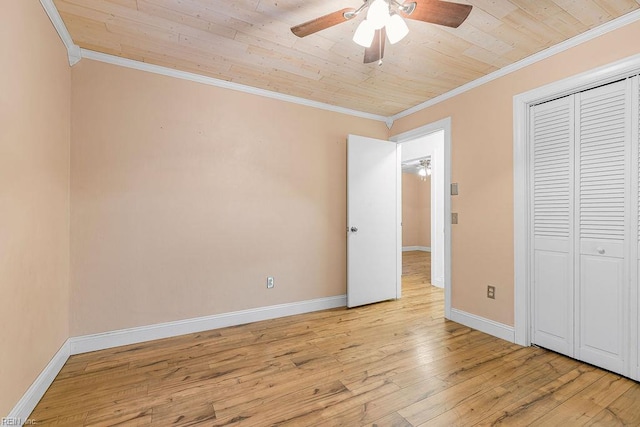 27195 Dogwood Bend Rd, Franklin, VA 23851 - unfurnished bedroom with crown molding, light wood-style flooring, wood ceiling, baseboards, and a closet