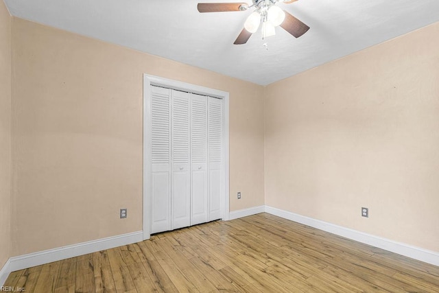 27195 Dogwood Bend Rd, Franklin, VA 23851 - unfurnished bedroom featuring baseboards, wood-type flooring, a closet, and ceiling fan