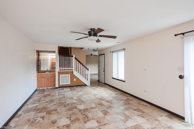 1705 Ocean Bay Dr, Virginia Beach, VA 23454 - spare room with a ceiling fan, stairs, baseboards, and stone finish floors