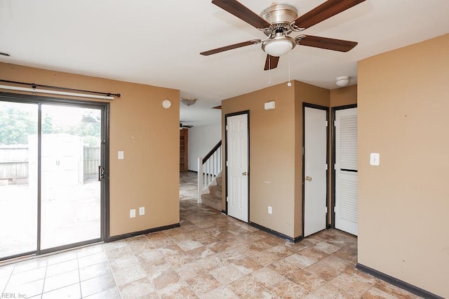 1705 Ocean Bay Dr, Virginia Beach, VA 23454 - unfurnished room featuring a ceiling fan, baseboards, and stairway