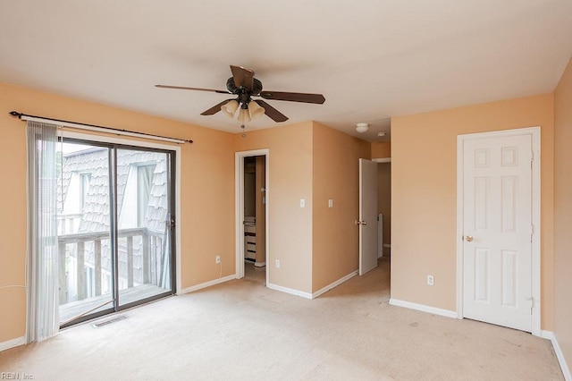 1705 Ocean Bay Dr, Virginia Beach, VA 23454 - unfurnished bedroom with access to exterior, light colored carpet, baseboards, and ceiling fan