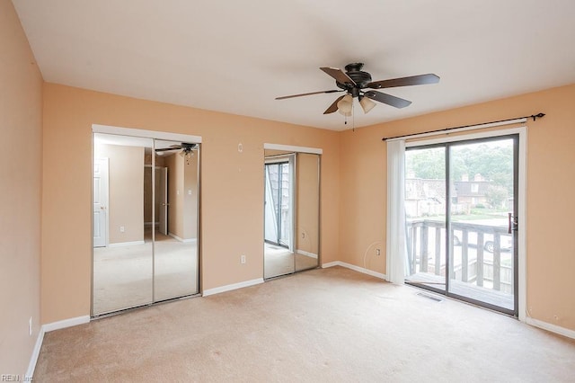 1705 Ocean Bay Dr, Virginia Beach, VA 23454 - unfurnished bedroom featuring two closets, access to exterior, carpet floors, and baseboards