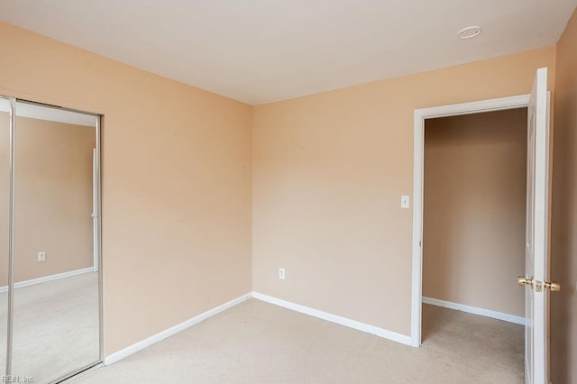 1705 Ocean Bay Dr, Virginia Beach, VA 23454 - unfurnished bedroom featuring light colored carpet, baseboards, and a closet