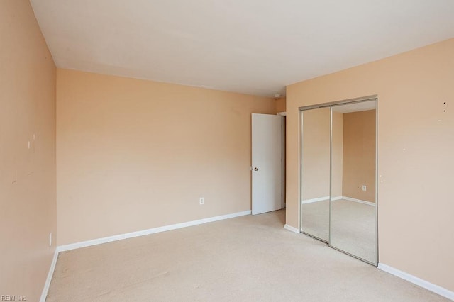 1705 Ocean Bay Dr, Virginia Beach, VA 23454 - unfurnished bedroom with a closet, light colored carpet, and baseboards