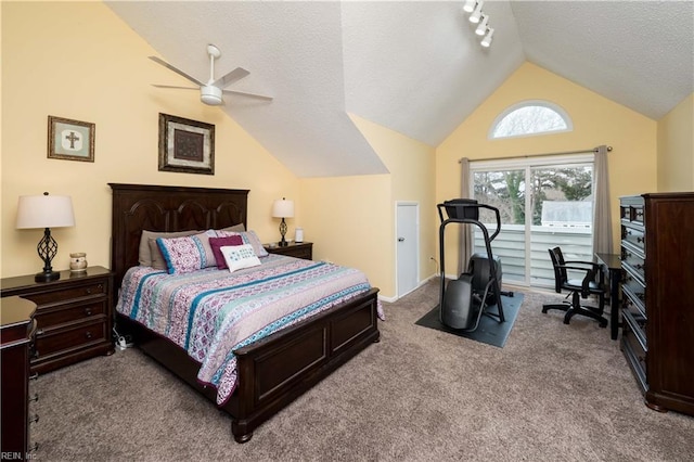 bedroom with vaulted ceiling, access to outside, carpet flooring, a textured ceiling, and ceiling fan