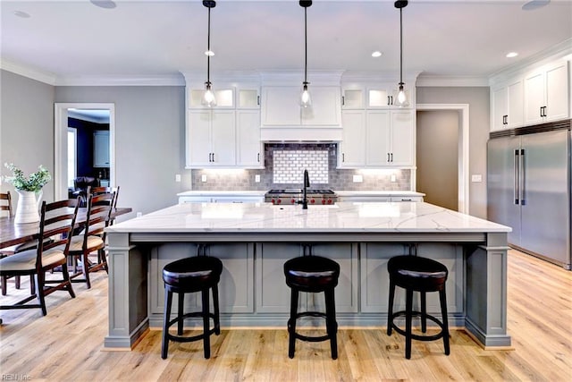 116 Formby, Williamsburg, VA 23188 - kitchen featuring built in fridge, white cabinetry, a large island, backsplash, and crown molding
