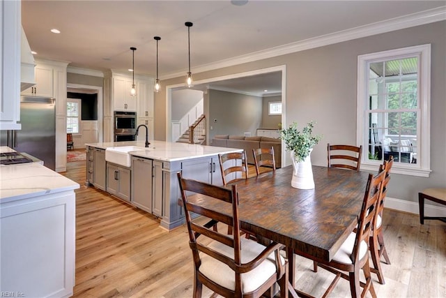 116 Formby, Williamsburg, VA 23188 - dining area featuring light wood-style floors, ornamental molding, healthy amount of natural light, stairs, and recessed lighting