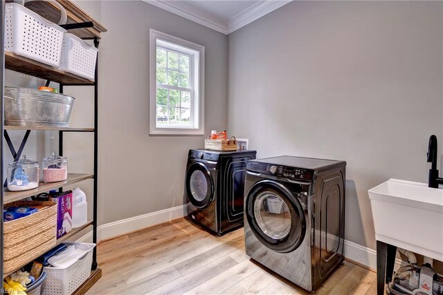 116 Formby, Williamsburg, VA 23188 - laundry room with washer and clothes dryer, baseboards, ornamental molding, and wood finished floors