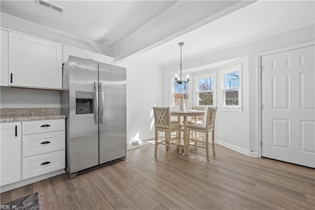 332 Shawen Dr, Hampton, VA 23669 - kitchen featuring stainless steel fridge, ornamental molding, white cabinetry, light wood finished floors, and a chandelier