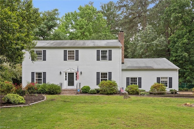 212 Walden Dr, Yorktown, VA 23692 - colonial house with a chimney, a front lawn, and entry steps