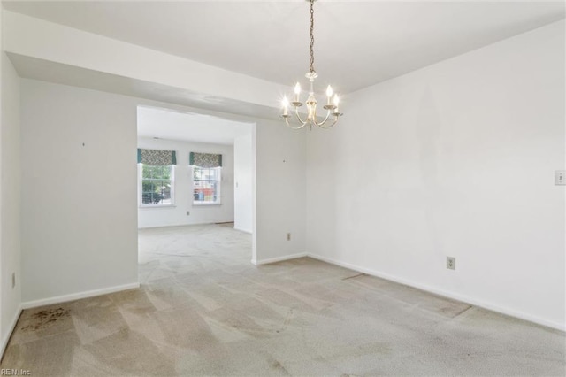 6017 Glen View Dr, Virginia Beach, VA 23464 - spare room with carpet flooring, a chandelier, and baseboards