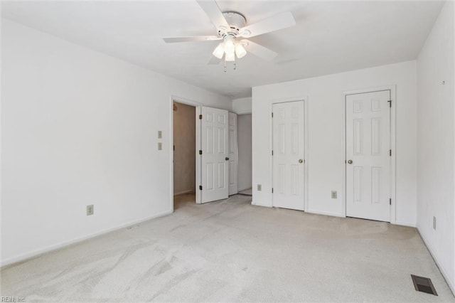 6017 Glen View Dr, Virginia Beach, VA 23464 - unfurnished bedroom with carpet floors, multiple closets, baseboards, and ceiling fan