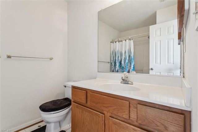 6017 Glen View Dr, Virginia Beach, VA 23464 - bathroom with toilet, vanity, curtained shower, and baseboards