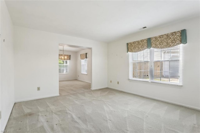 6017 Glen View Dr, Virginia Beach, VA 23464 - carpeted empty room with a chandelier and baseboards