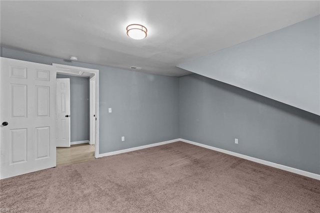 bonus room featuring carpet floors and baseboards