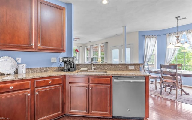 2230 Angler Ln, Chesapeake, VA 23323 - kitchen with stainless steel dishwasher, a sink, healthy amount of natural light, and a peninsula