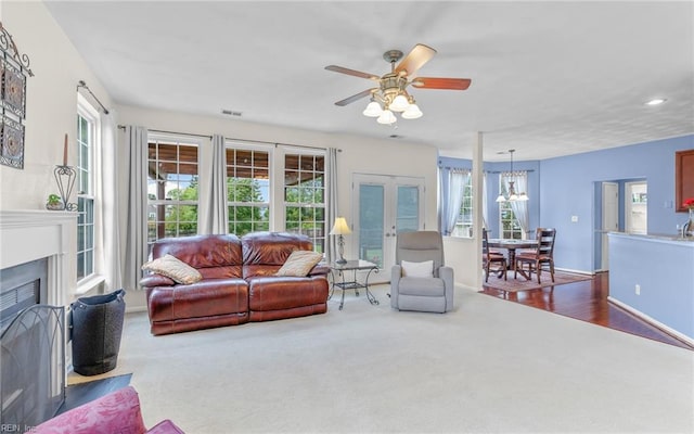 2230 Angler Ln, Chesapeake, VA 23323 - living room featuring carpet floors, plenty of natural light, a fireplace with flush hearth, recessed lighting, and a chandelier