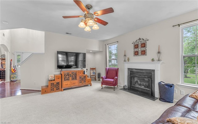 2230 Angler Ln, Chesapeake, VA 23323 - living area with healthy amount of natural light, a fireplace with flush hearth, carpet floors, and ceiling fan