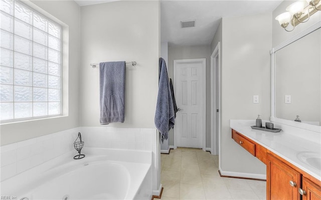2230 Angler Ln, Chesapeake, VA 23323 - full bathroom featuring a bath, vanity, tile patterned flooring, and baseboards