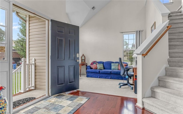 2230 Angler Ln, Chesapeake, VA 23323 - entrance foyer featuring wood finished floors, stairway, and high vaulted ceiling