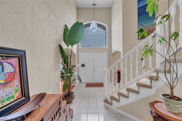 2537 Springhaven Dr, Virginia Beach, VA 23456 - foyer entrance with a chandelier, stairs, a high ceiling, and tile patterned floors