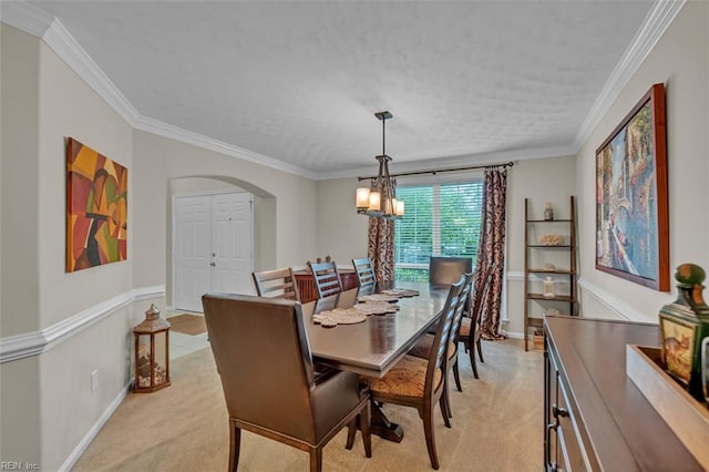 2537 Springhaven Dr, Virginia Beach, VA 23456 - dining area with light carpet, a chandelier, arched walkways, crown molding, and baseboards