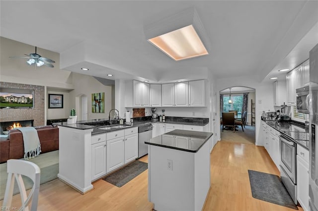 2537 Springhaven Dr, Virginia Beach, VA 23456 - kitchen with appliances with stainless steel finishes, a sink, light wood-style floors, white cabinetry, and recessed lighting